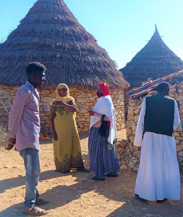 Sulieman Haji Idris Supports Nura in Her Campaigning to Other Unreached Families. Credit: Yosief Abraham Z.