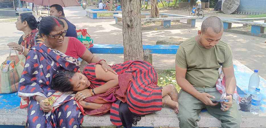 Patients waiting for test reports near a fever clinic in Kolkata.