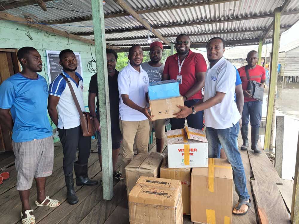 Dr Nchinjoh (right) receives supplies. Credit: Dr Sangwe Clovis Nchinjoh