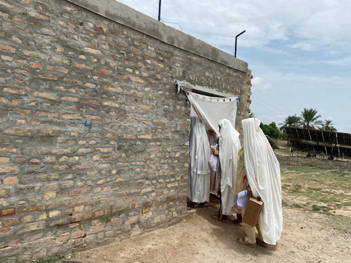 PHC Global team entering the house of Alma to convince her to vaccinate her family children