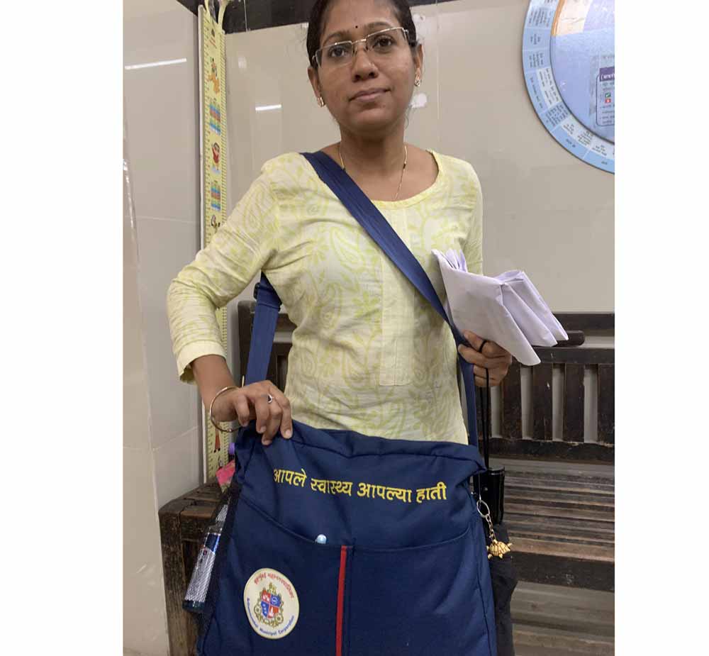 ASHA worker Jyoti Patil with her new BMC issued bag. Credit: Sweta Daga