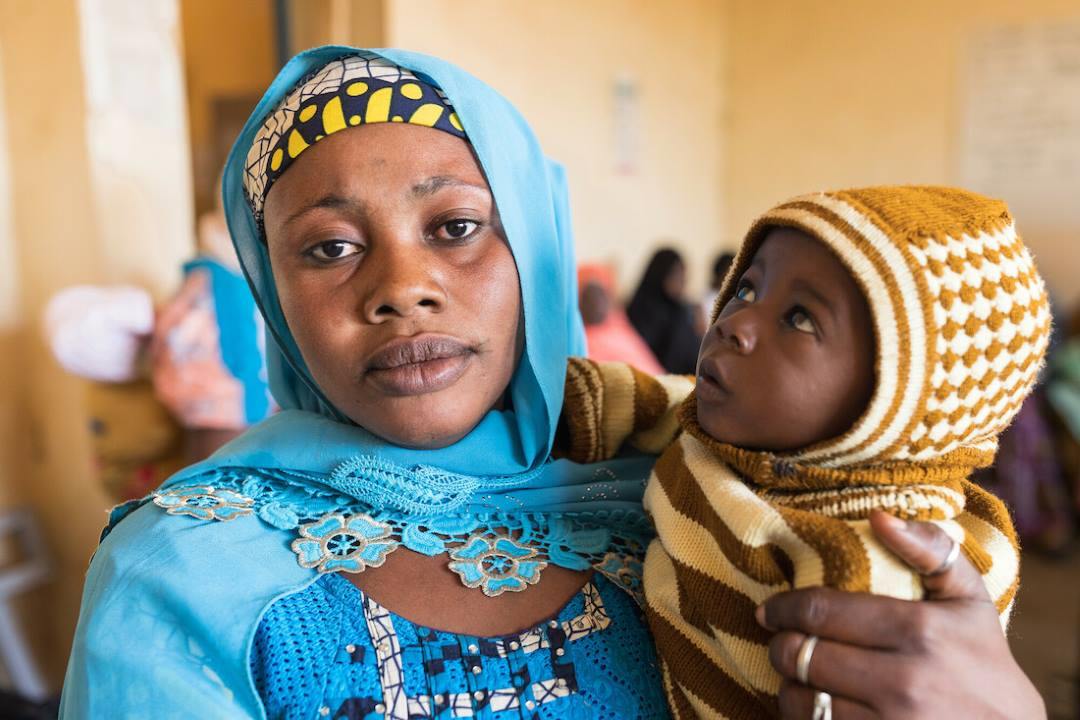 Djamila Saley with her son at CSI Madina, a health centre in Niamey, Niger.