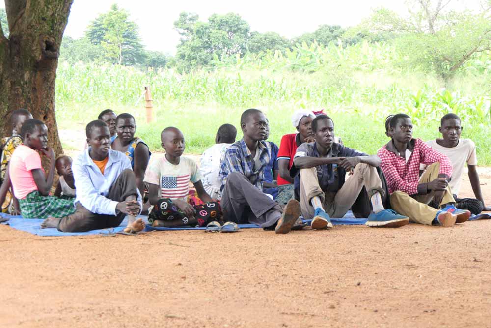 Adolescents and children with nodding syndrome attend a community health camp in the village of Ayom. They attend with their parents, and receive medication and additional treatment from wounds and seizures caused by the disease. Credit: Pat Robert Larubi