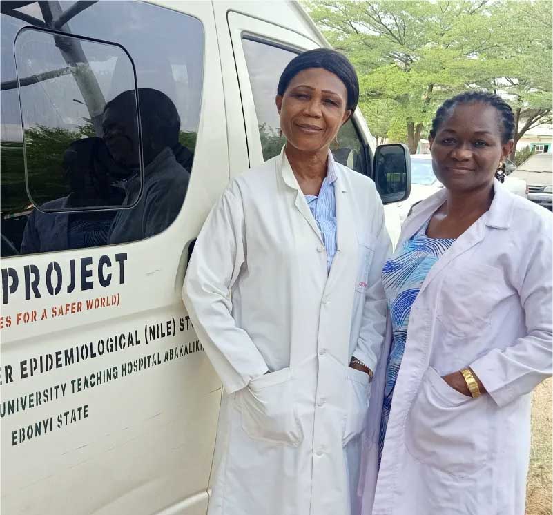 Dr Nnennaya Ajayi standing by hospital van. Credit: CEPI