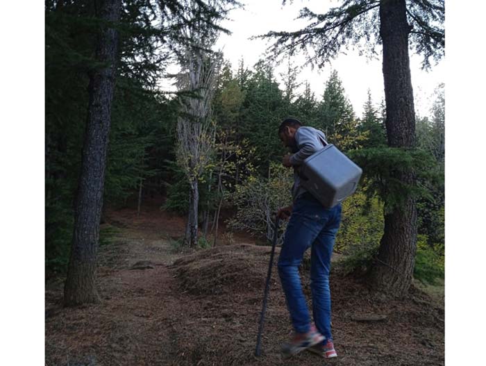 Despite difficulty walking, Irshad Ahmad continues to tread on trails to ensure vaccination in one of the remotest villages on the mountainous India-Pakistan border