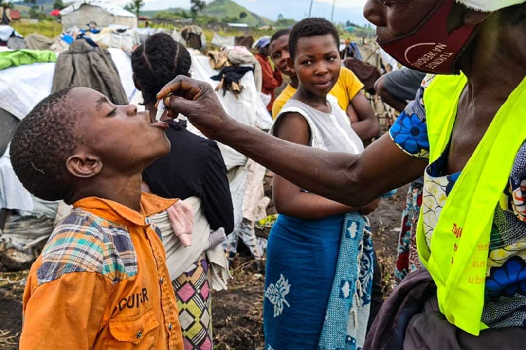 A child receiving oral cholera vaccine. © WHO / Eugene Kabambi