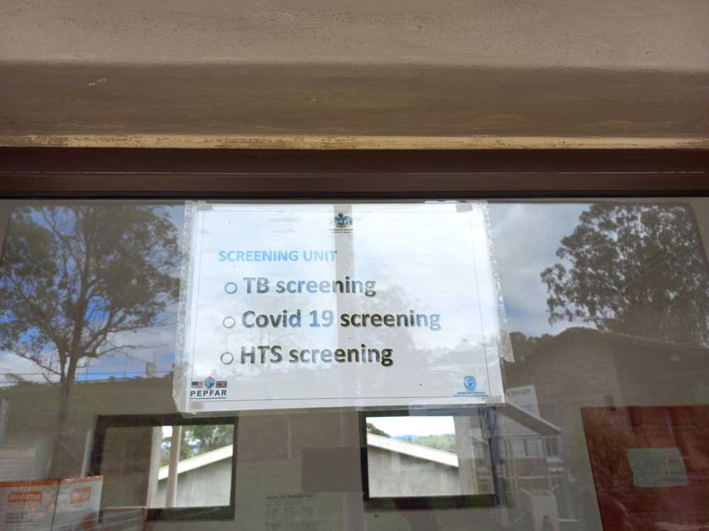 A sign about screening services.