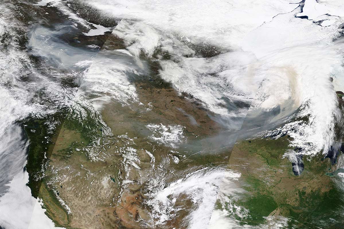 Satellite image of smoke from the Canadian wildfires on May 14, 2024. The 2024 Canadian fire season started early with 337,000 hectares burned by mid-May, primarily in the western province of British Columbia. Smoke from the Canadian wildfires drifted into the US, causing air quality alerts in four US states. Image by MODIS Land Rapid Response Team, NASA GSFC via Wikimedia Commons.