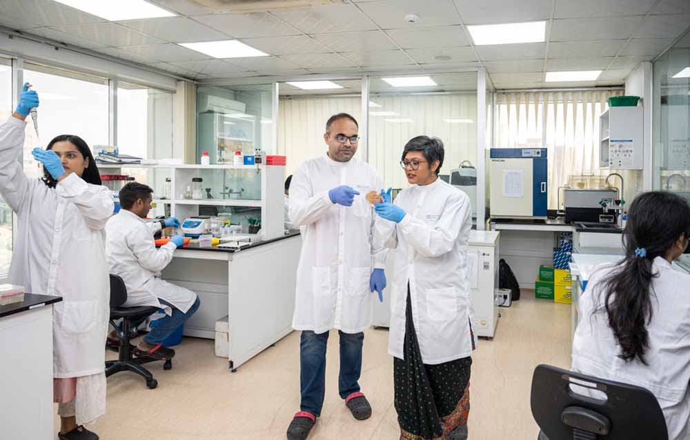 Working with sample water collected from drains at CHRF llab