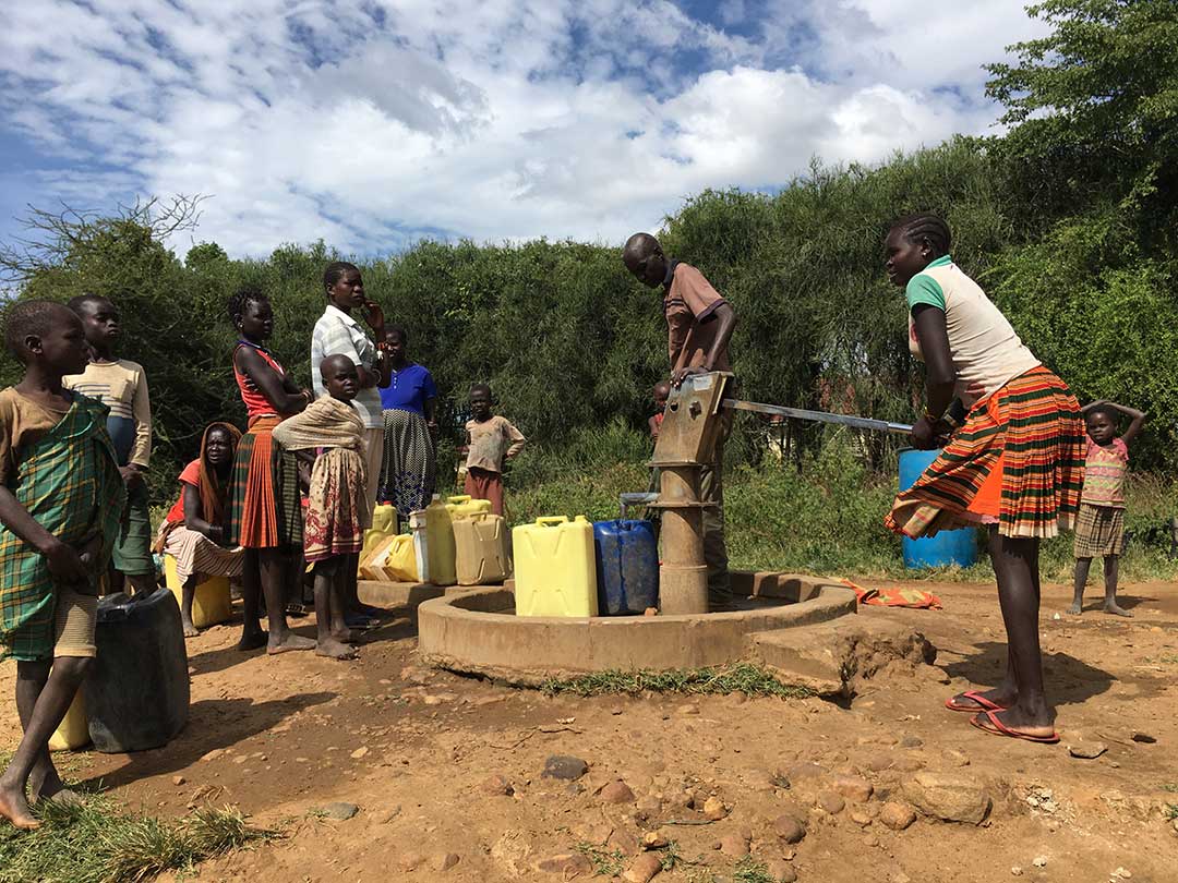 Getting water from a hand pump is tiring and means users have to wait to use the one outlet. Sometimes hand pumps break down and take time to repair, meaning the community is forced to go without clean water. Credit: Pius Sawa