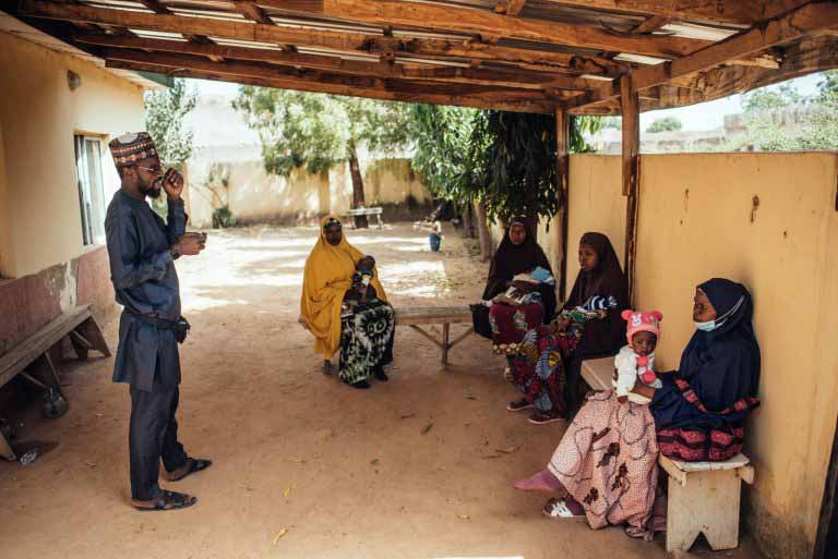 NI-ABAE field officer addressing carers at Dawanau PHC, Kano. Photo Credit: Nigeria Health Watch