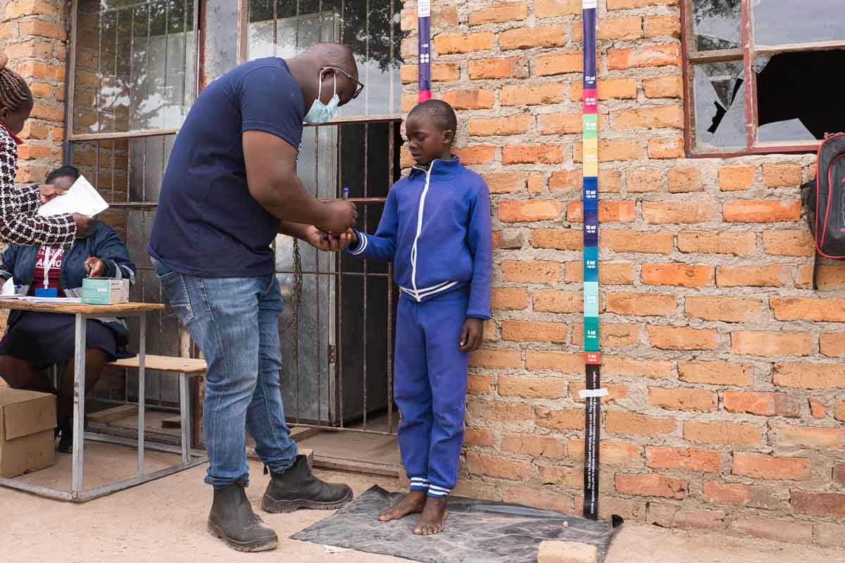 7 year old Ariel receives trachoma drugs during mass drug administration in Gweru in May 2024. Credit: Sightsavers/Jason Mulikita