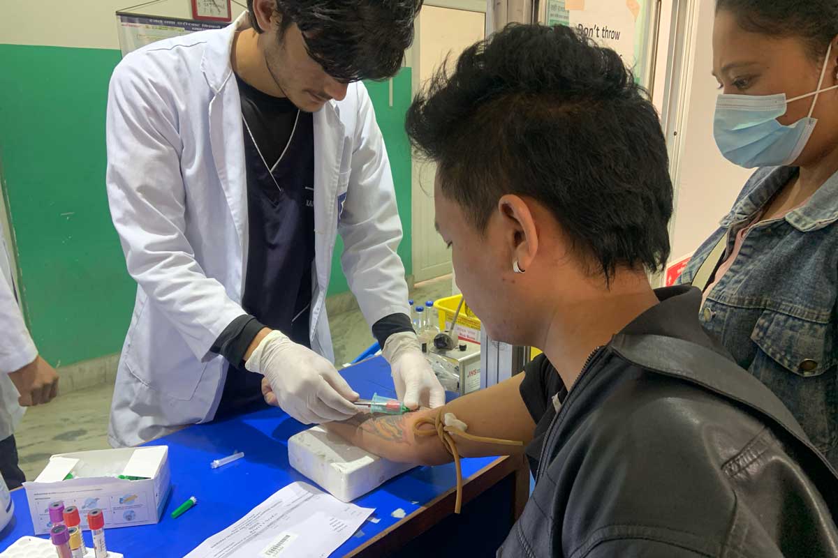 A dengue suspected patient undergoing a blood test. Credit: Pragya Timsina