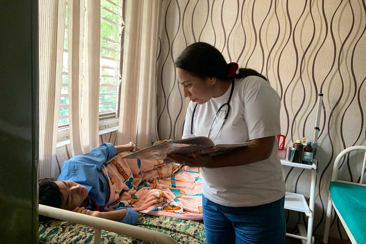 Nurse Sabita Regmi examining a student at school. Credit: Pragya Timsina.