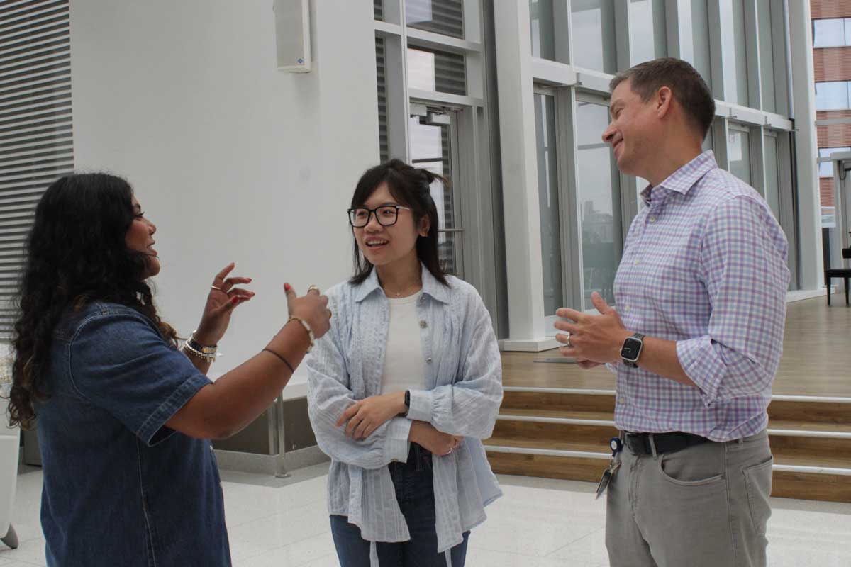 Kit Delgado, faculty director of the Penn Medicine Nudge Unit (right), speaks with senior statistical analyst Aria Xiong (middle) and director of strategy and operations Neda Khan (left) at a recent retreat of the nudge unit. Visual: Odelia Ghodsizadeh/UPenn