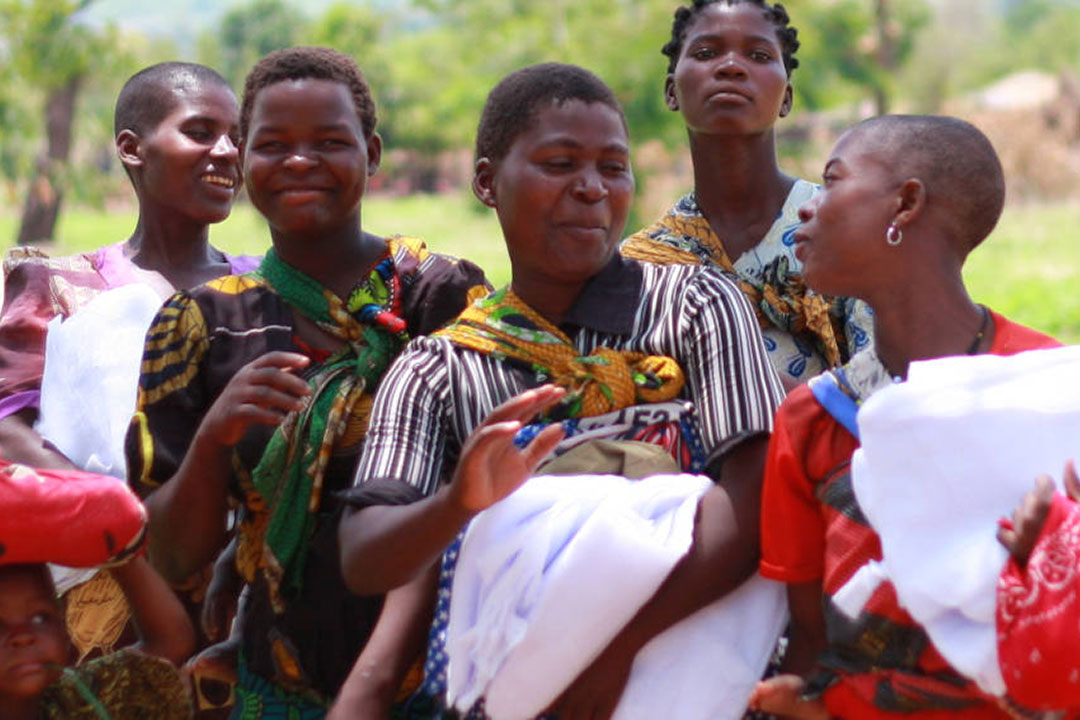 Malawi women and children with anti-malarial nets. African nations need to tailor interventions based on the local setting as blanket approaches spread precious resources too thin says Cynthia Mwase. Copyright: Ruthgrace (CC BY-SA 4.0 DEED)