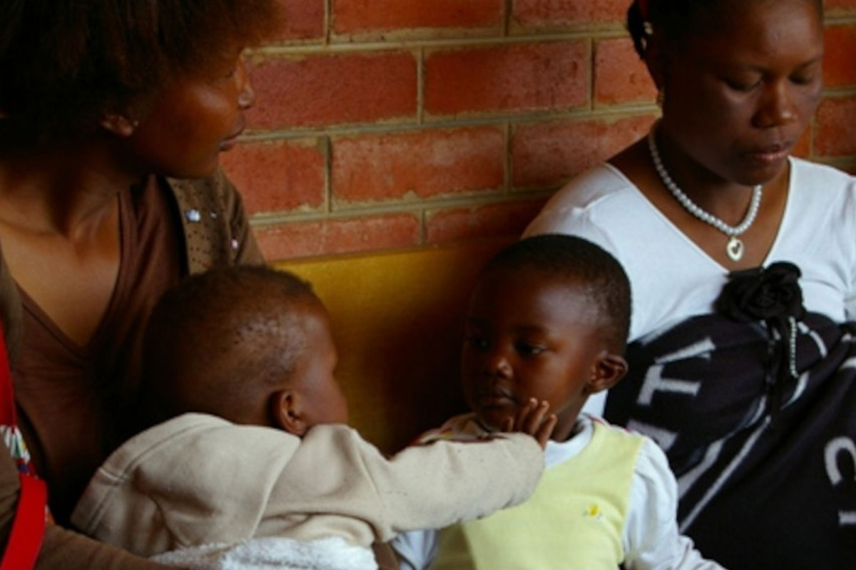 Mothers with babies waiting for an HIV education session at a clinic in Lesotho, Southern Africa. Male infants infected with HIV during pregnancy are more likely than girls to achieve sustained HIV remission after receiving treatment, researchers say. Copyright: Courtesy of kommanderkat (CC BY-NC 2.0)