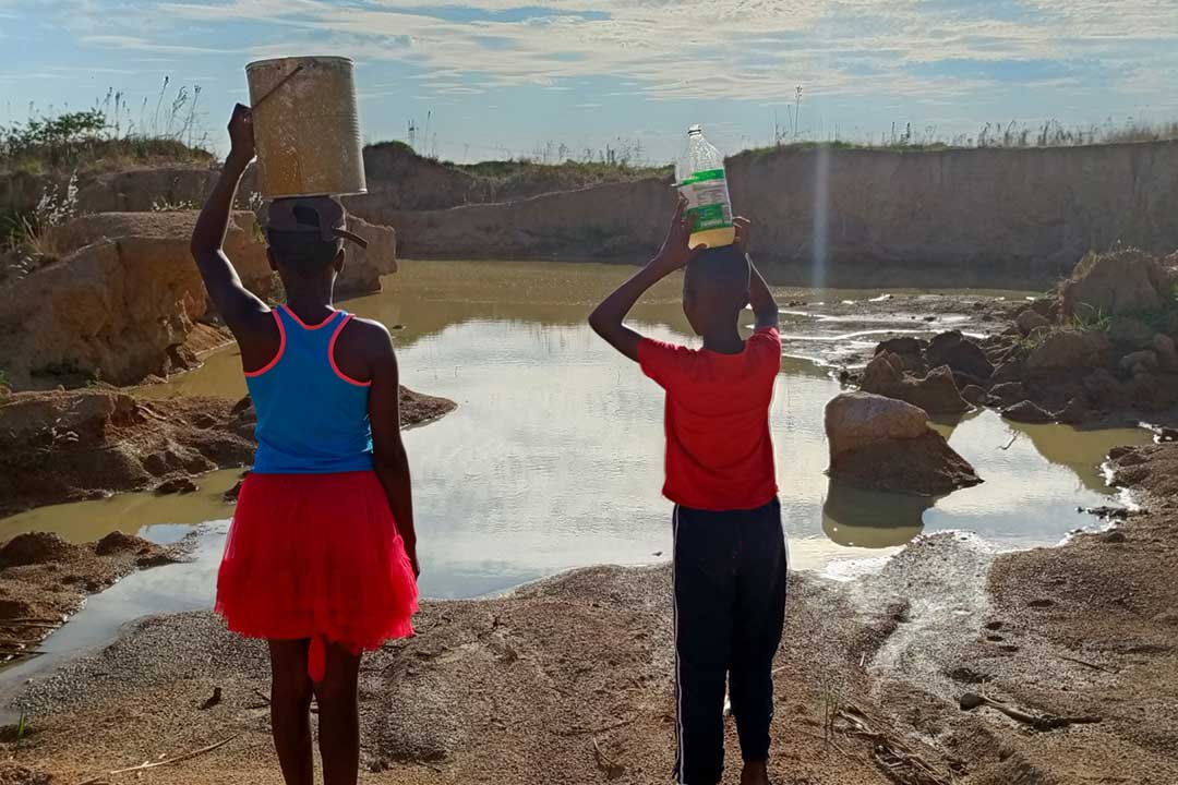 With inceased water shortage, people are fetching water from unprotected sources, putting their lives on danger. Credit: Derick Matsengarwodzi