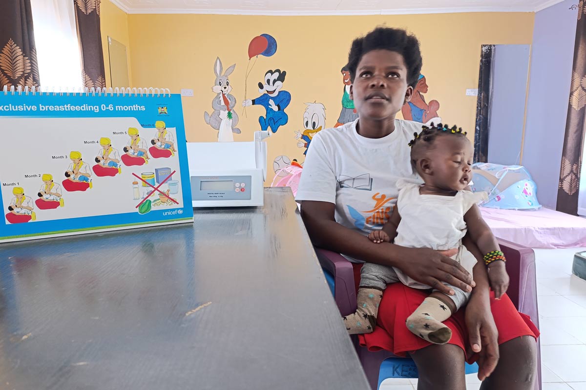 Antonina Anyango holds her eight month old baby during a routine visit at the Episcopal Church of Africa on 24 June 2024. Credit: Angeline Anyango