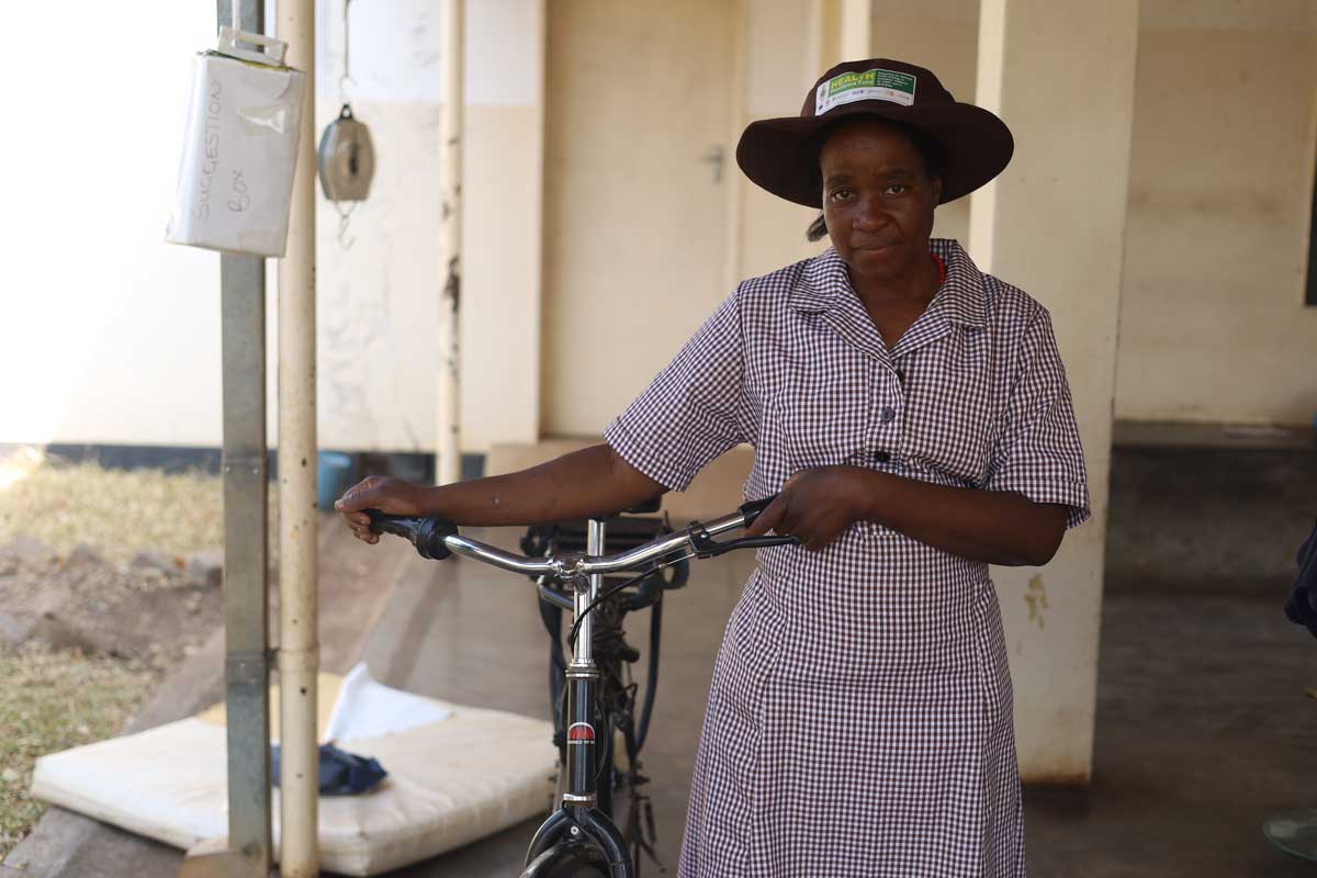 Maria Matuka's job as a community health workers is made easier by a bicycle built for the rugged roads in Chiredzi, Zimbabwe. Credit: Farai Shawn Matiashe/2024