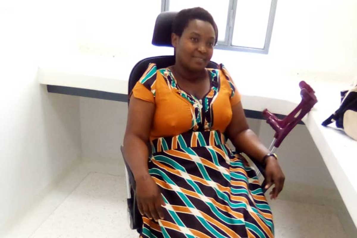 Annoncee Nyirangarukiyintwari poses for a picture inside Nyarugenge District Hospital where she works as a laboratory staff. Credit: Annoncee Nyirangarukiyintwari