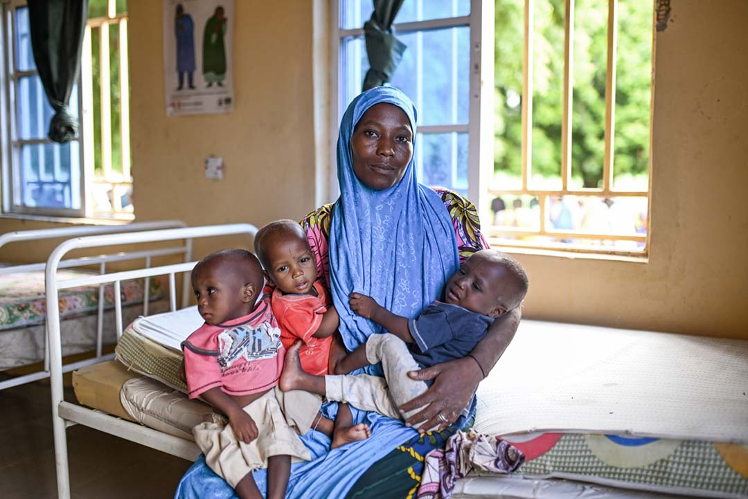 Hajara Yunusa (36) with her 20-month-old triplets inside Duhuma Health Post, Andaza ward, Jigawa state, Nigeria. Credit: Gavi/2023/Nr Dambali