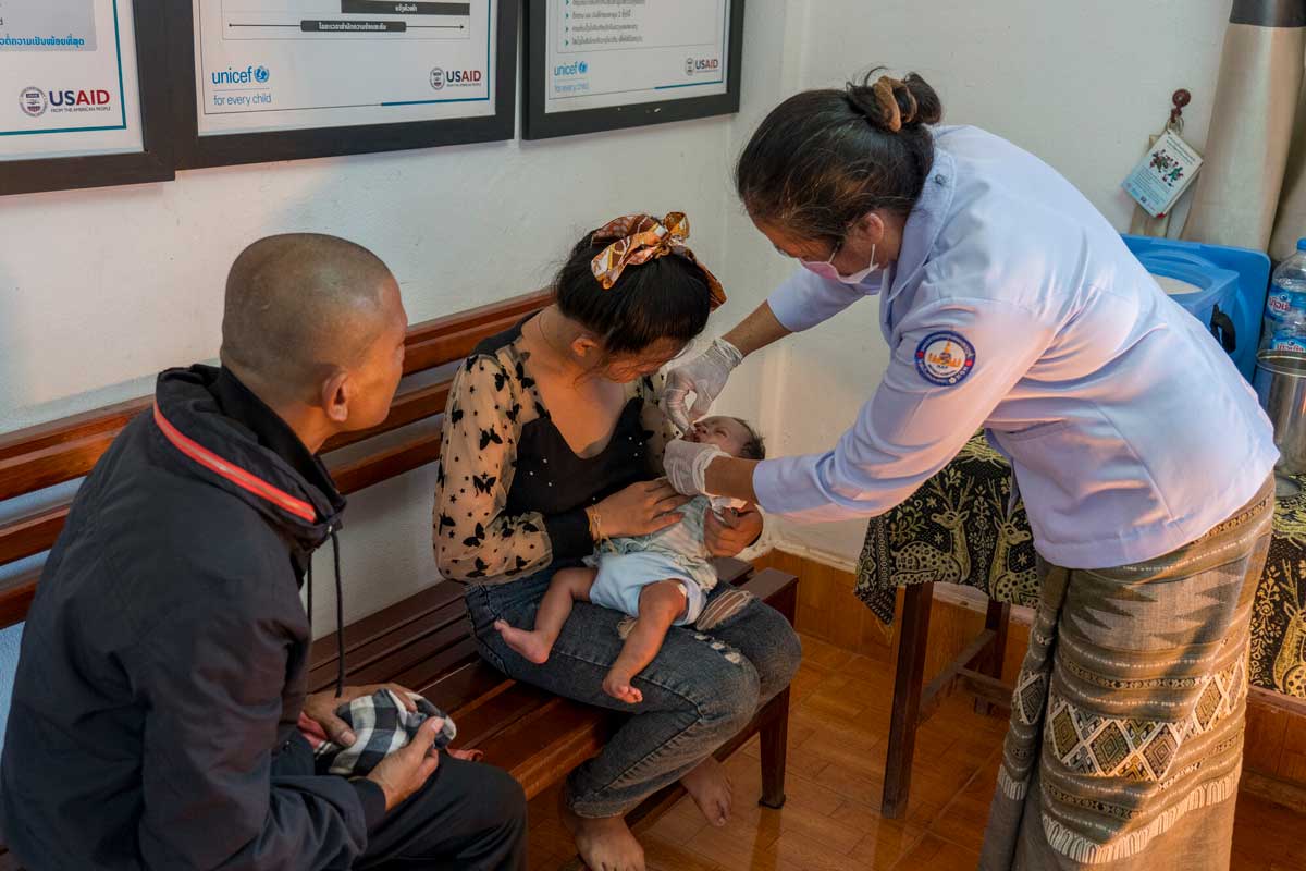 A healthcare worker administers an oral vaccine to a child at a health centre in Lao PDR. Credit: Gavi/2024/Running Reel