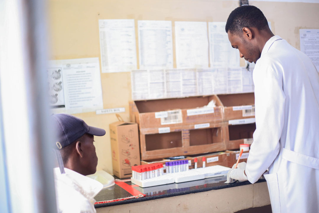 A lab technician works on a sample drawn from patient seeking treatment for reproductive health services at Maswa District Hospital. Credit: Syriacus Buguzi