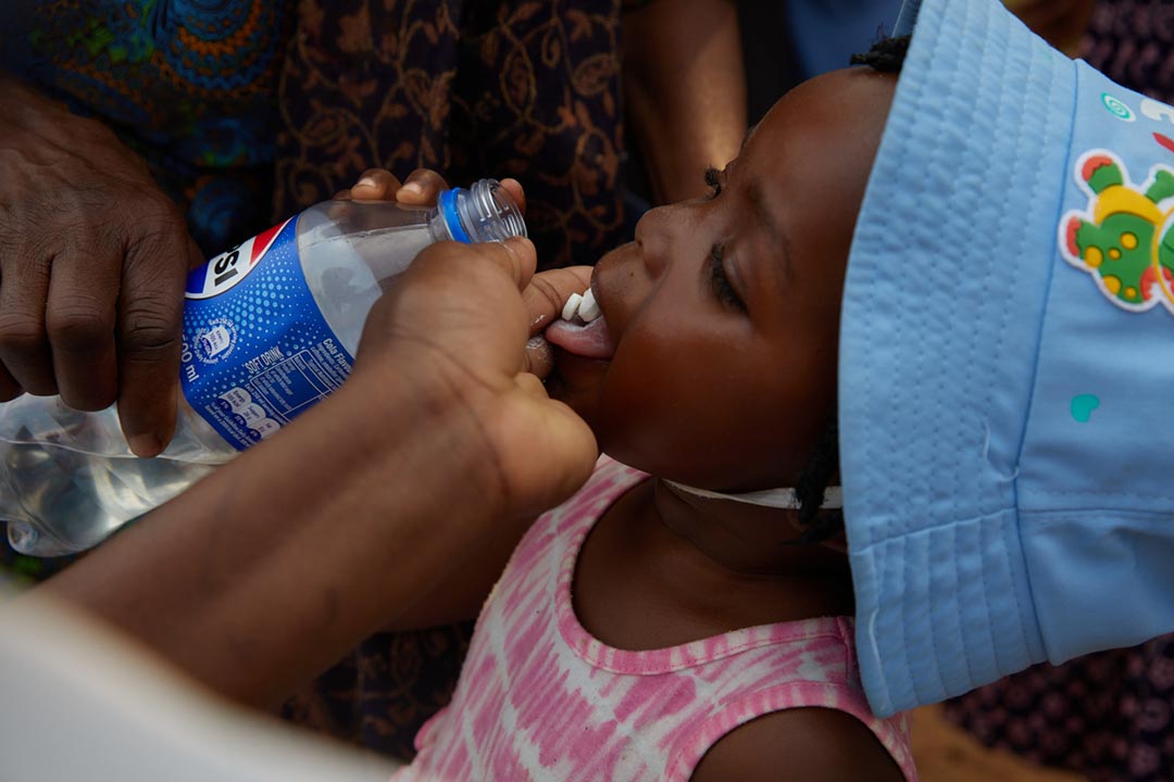A child receives elephantiasis tablets, during the recent Mass Drug Administration MDA campaign in Zimbabwe. Credit: Higherlife Foundation