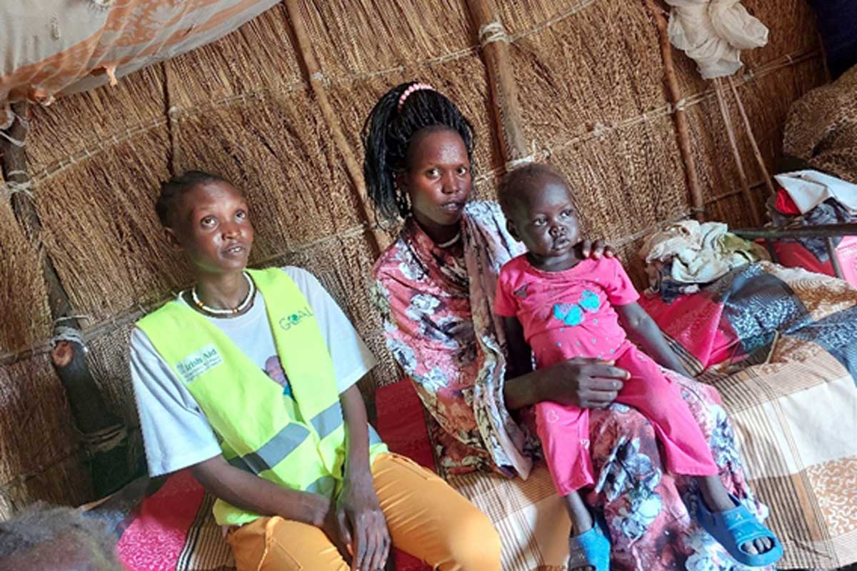 A GOAL health worker with a beneficiary family in South Sudan. Credit: GOAL South Sudan