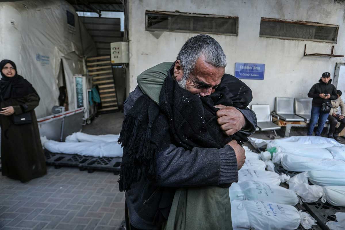 Palestinians bid farewell to their relatives who were killed during an Israeli air strike at Al-Najjar hospital in the southern Gaza Strip city of Rafah on 10 January 2024. Anas-Mohammed/shutterstock