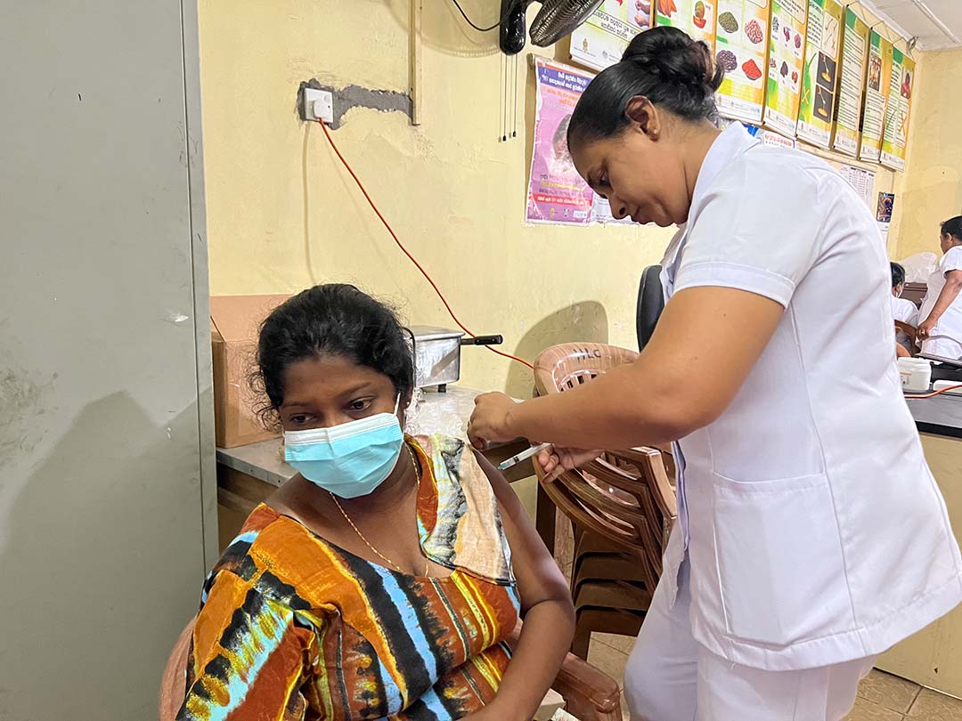 A mother-to-be gets vaccinated Credit: Aanya Wipulasena