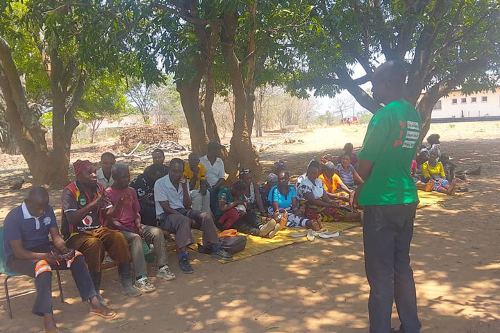 District Health Official Temwanani Mtonga speaks during a malaria vaccine sensitisation meeting in Lumezi District. Credit: Temwanani Mtonga
