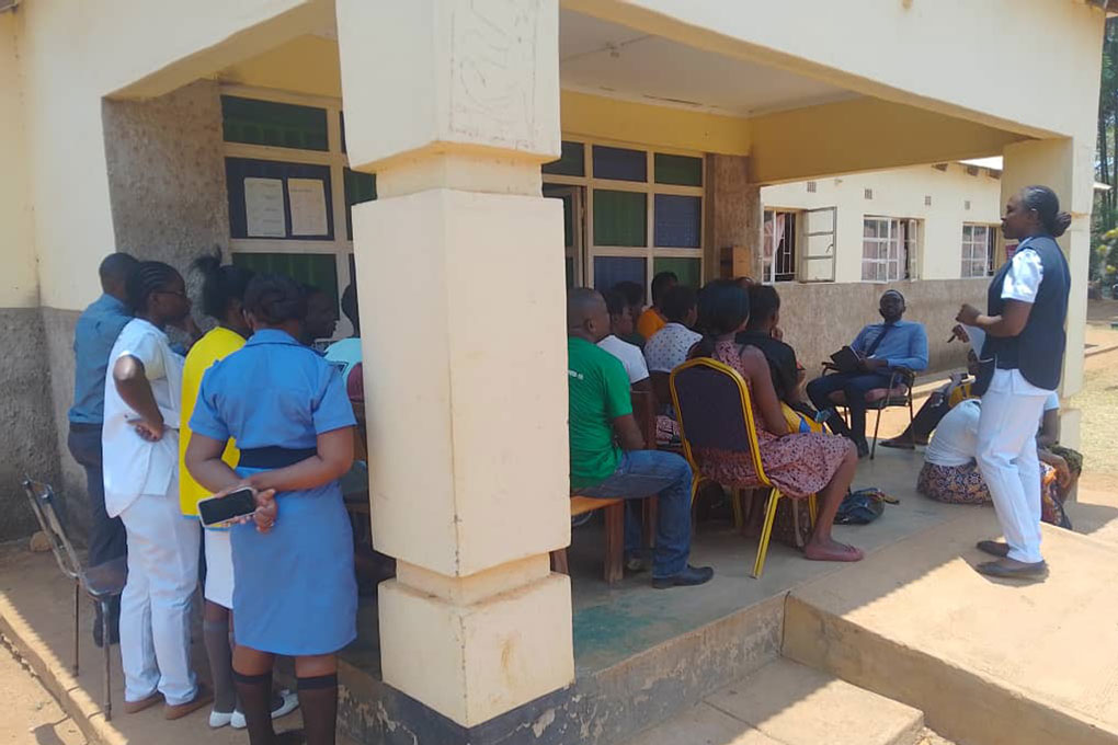 Health workers and volunteers are briefed about the malaria vaccine before patients arrive at Lumezi Urban Clinic. Credit: Temwanani Mtonga