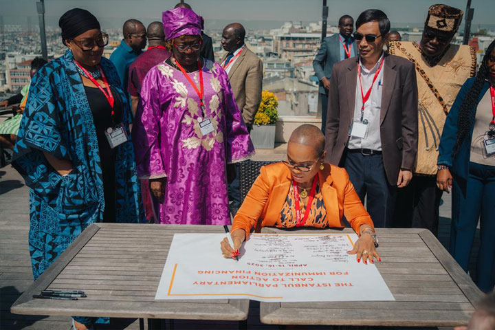 Hon. Prescilla Abram Cooper, Liberia, signs the Istanbul Parliamentary Call to Action for Immunization Financing.