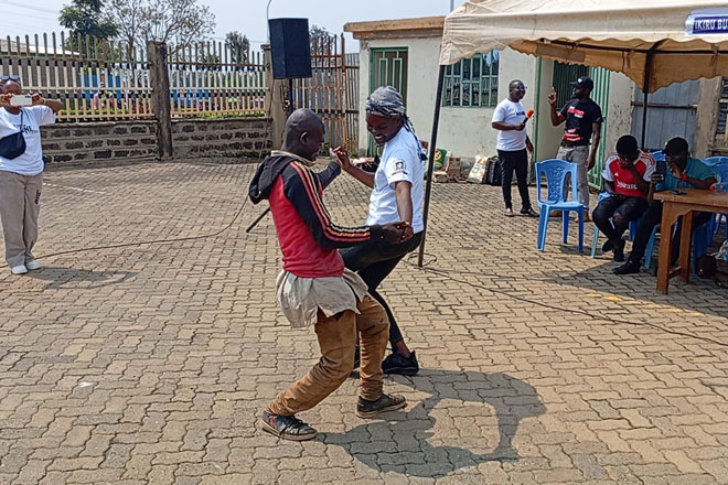 A short skit is performed by members of the Kenya Malaria Youth Corps. Credit: KeMYC