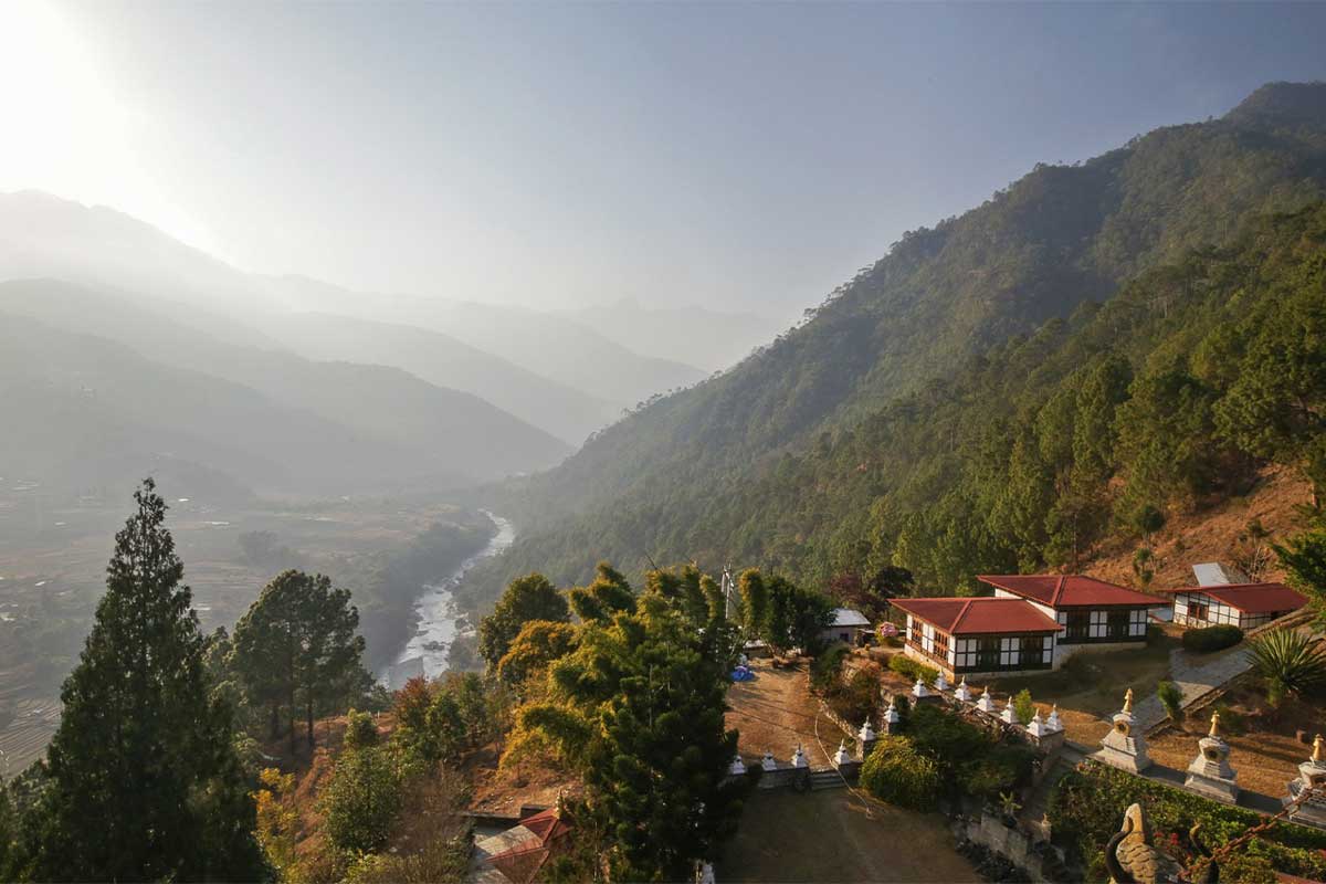 Climate change has begun impacting key industries in the Himalayan nation of Bhutan, including agriculture and tourism, while also threatening hydropower. Seen here is the Khamsum Yulley Namgyal Chorten in Punakha Valley, Bhutan, a popular stop on tourist itineraries. Image by Petro Kotze.