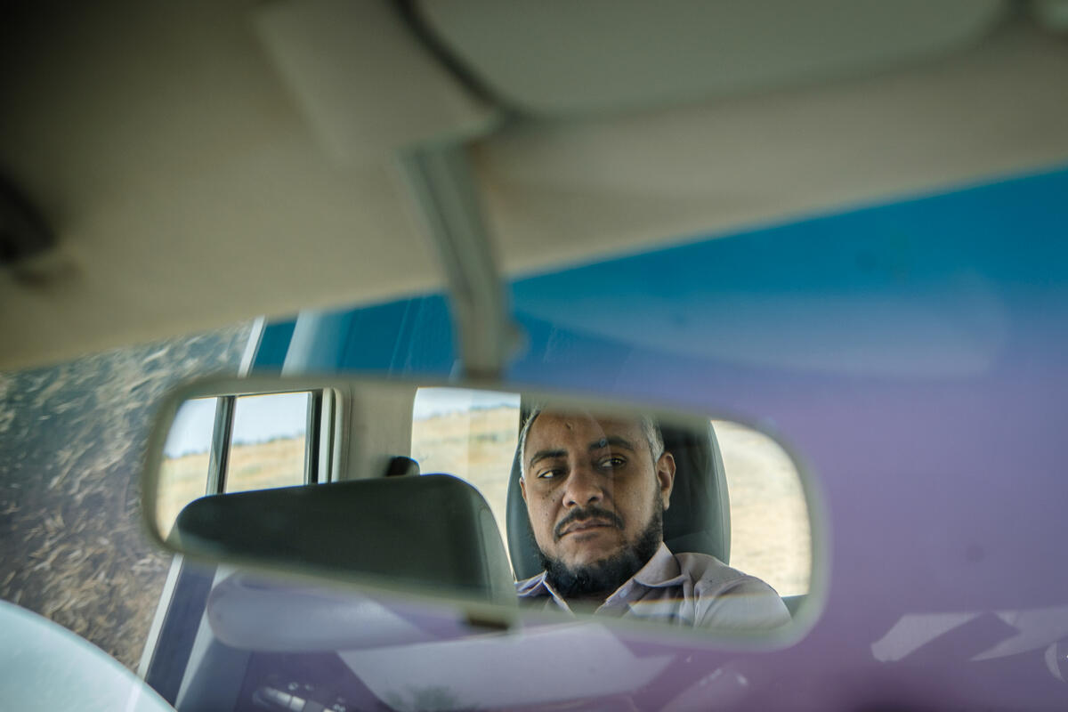 Afeef, logistics vaccine officer with the International Rescue Committee on the way to Umm Al-Khair, for a campaign to vaccinate children at the local hospital. Al Qadarif, Sudan. March 4, 2025.