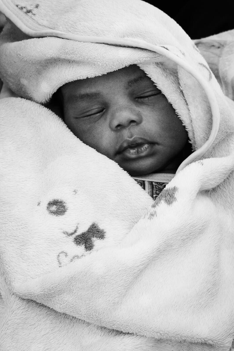 A child waiting his turn to get vaccinated. Humra, Galabat Ash-Shargiah, Sudan. March 9, 2025.