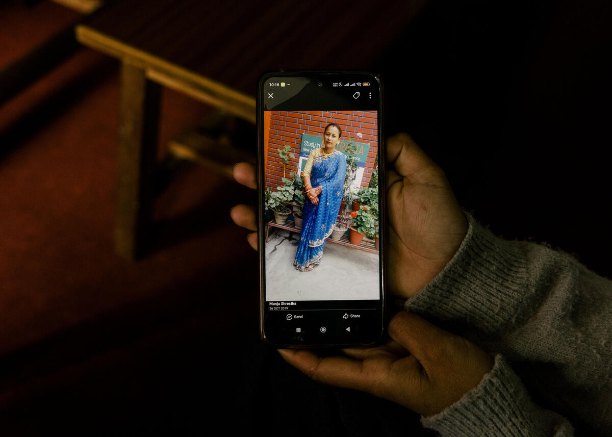 Aniva shows the portrait of her aunt, who died from HPV cancer. Kathmandu. March 8, 2025.