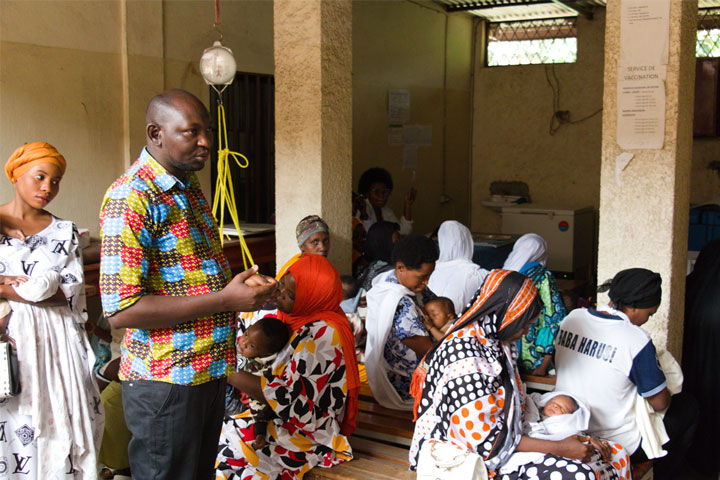 Nyamundende Assumani reaching out to parents about routine vaccination. Credit: Moses Havyarimana
