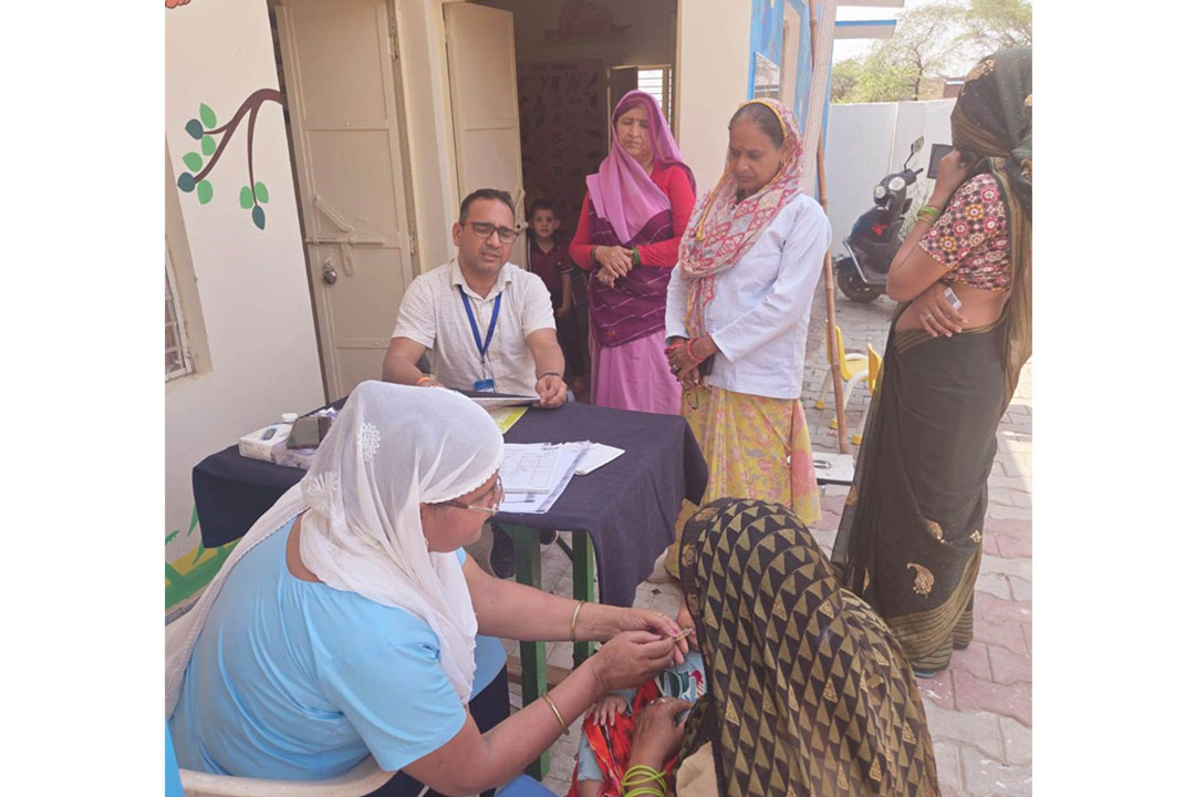 Officials inspect a vaccination centre. Credit: