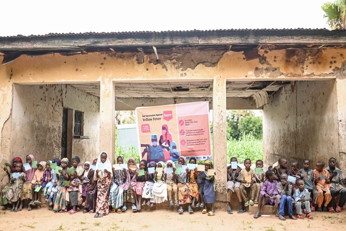Children pose for a group photo with their yellow fever vaccine certificates in Nigeria. Credit: Gavi/2023/Nr Dambali