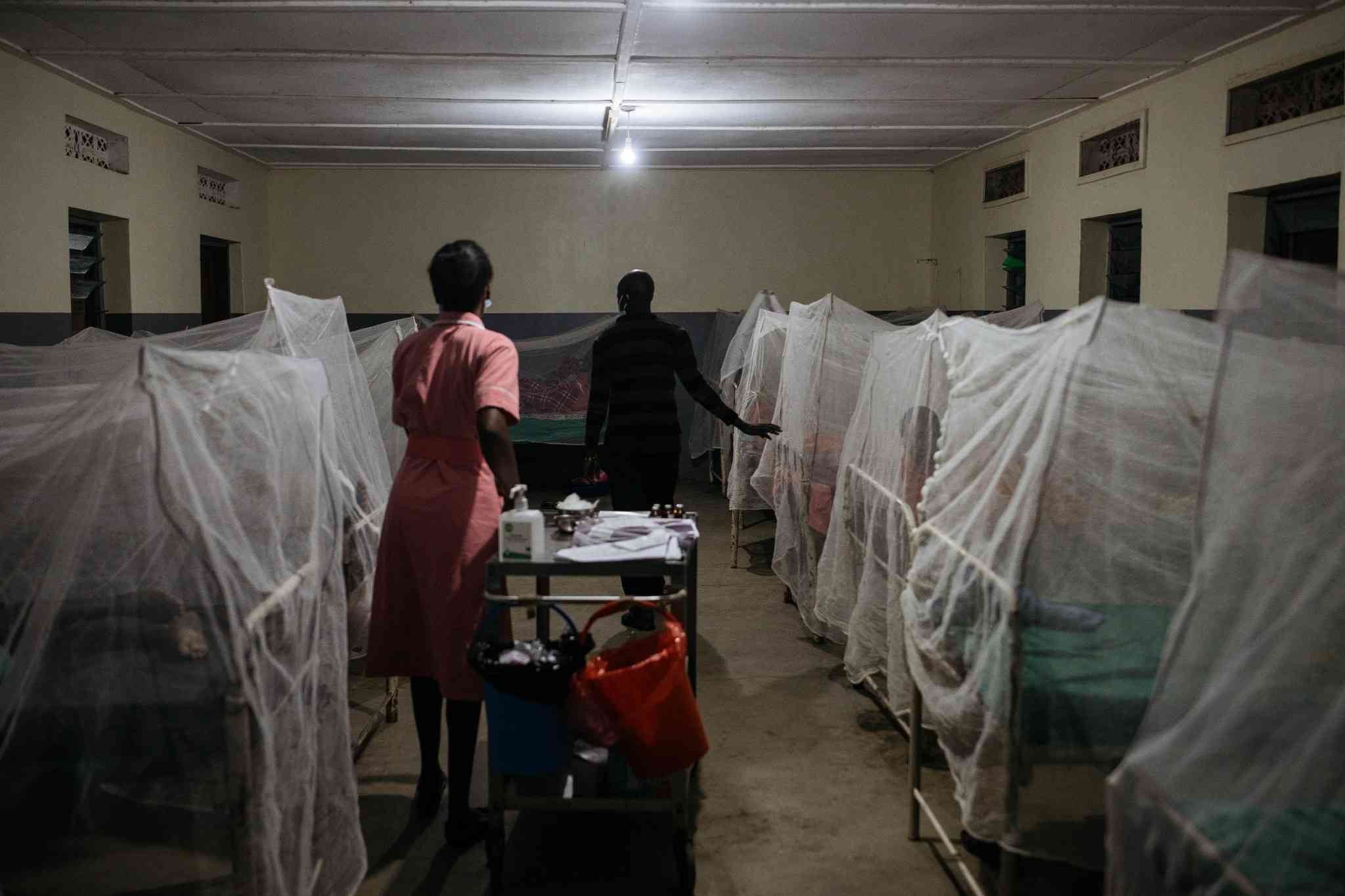 Priscilla Chebjira, the lead nurse at Amudat clinic, with a colleague to give kalazar patients their shots at 5am each day.