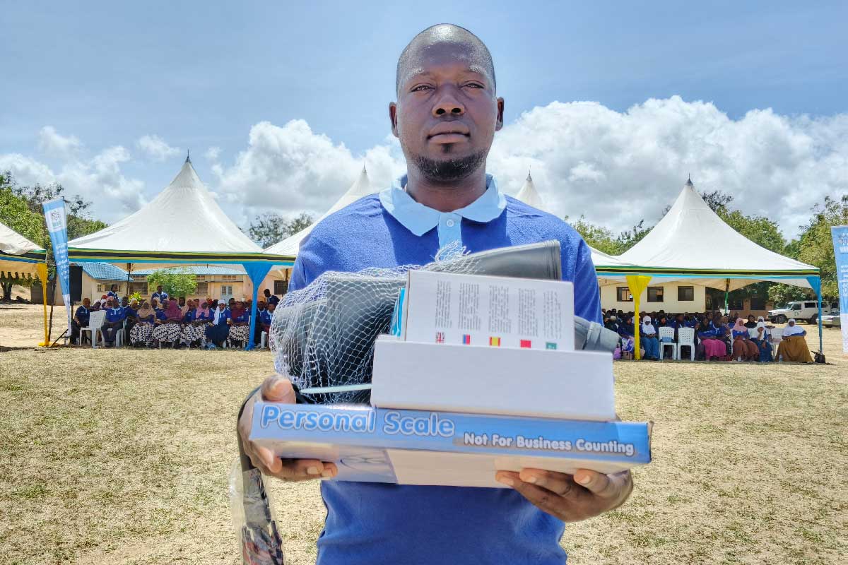 Bamvua Ashim Mkundia, one of the newly trained CHWs, holds his tools shortly after graduation in August 2025 in Lindi Region. Credit: Ministry of Health Tanzania