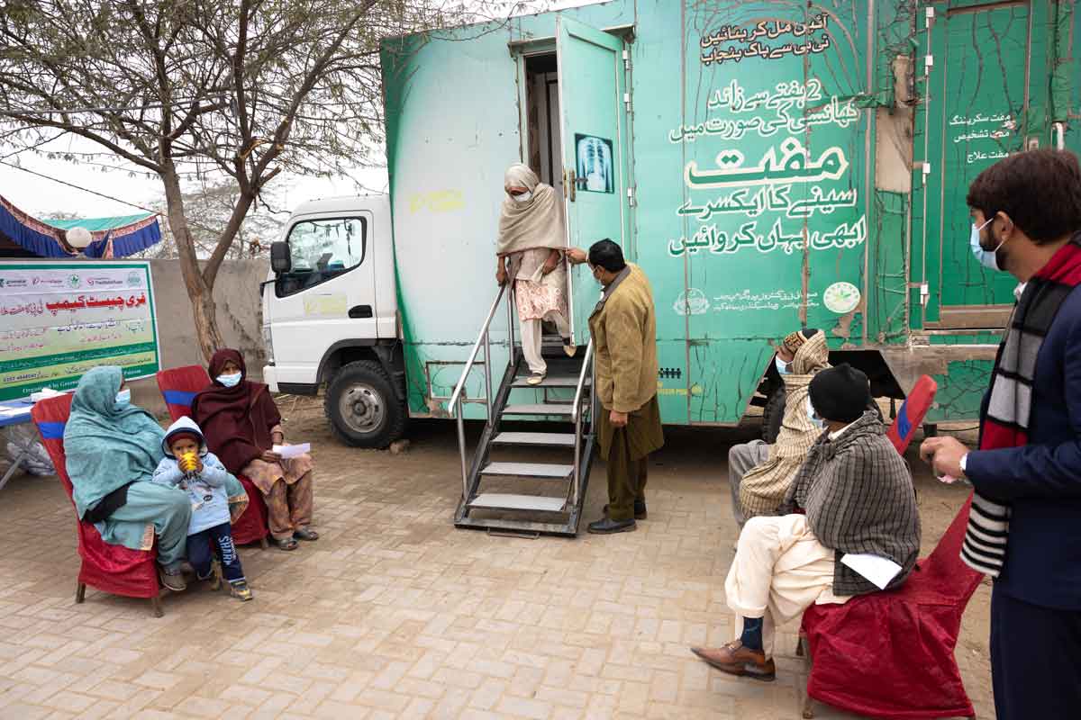 A patient steps out of a truck at the chest camp. Credit: Vincent Becker