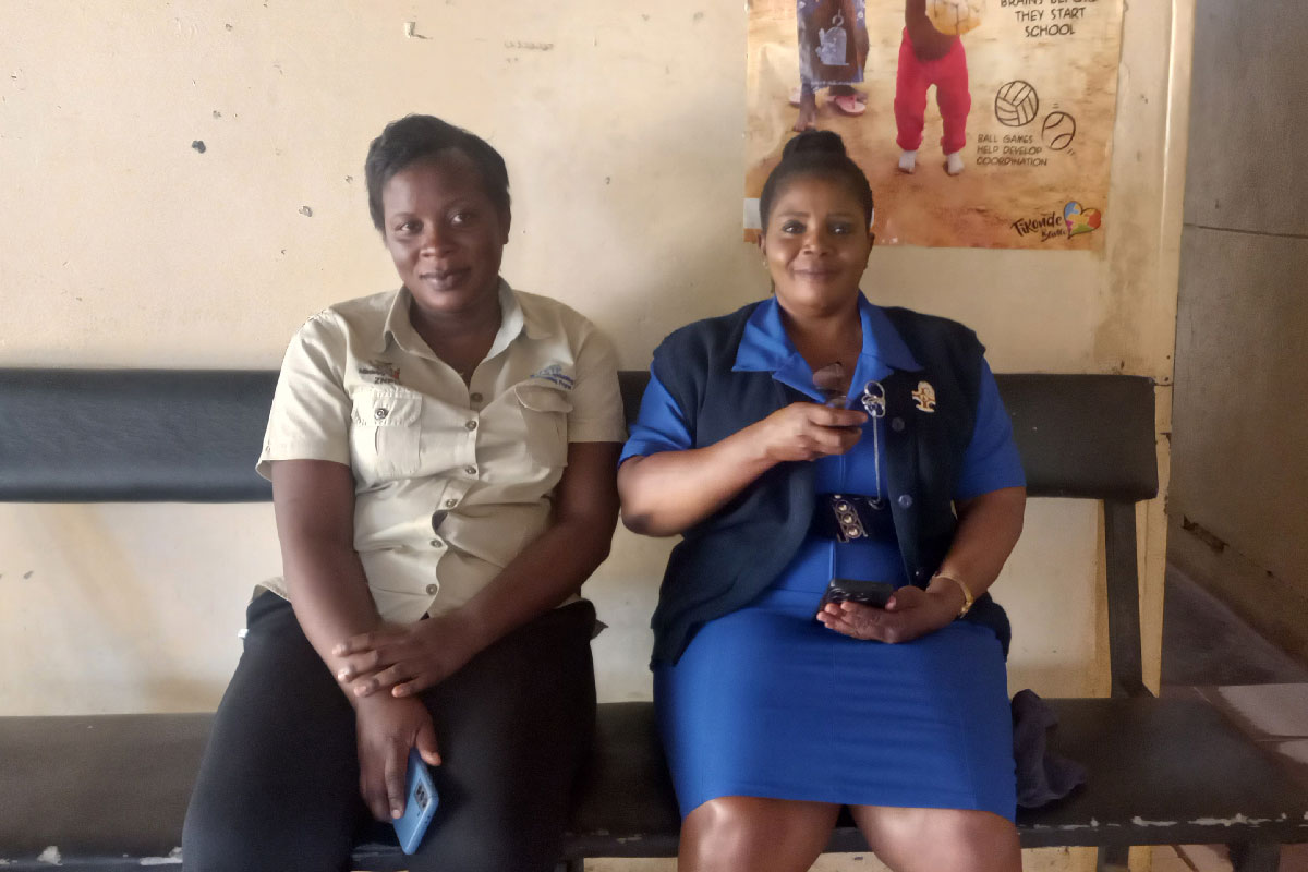 District Nursing Officer Violet Mwanza in blue uniform and her colleague. Credit: Fiske Nyirongo