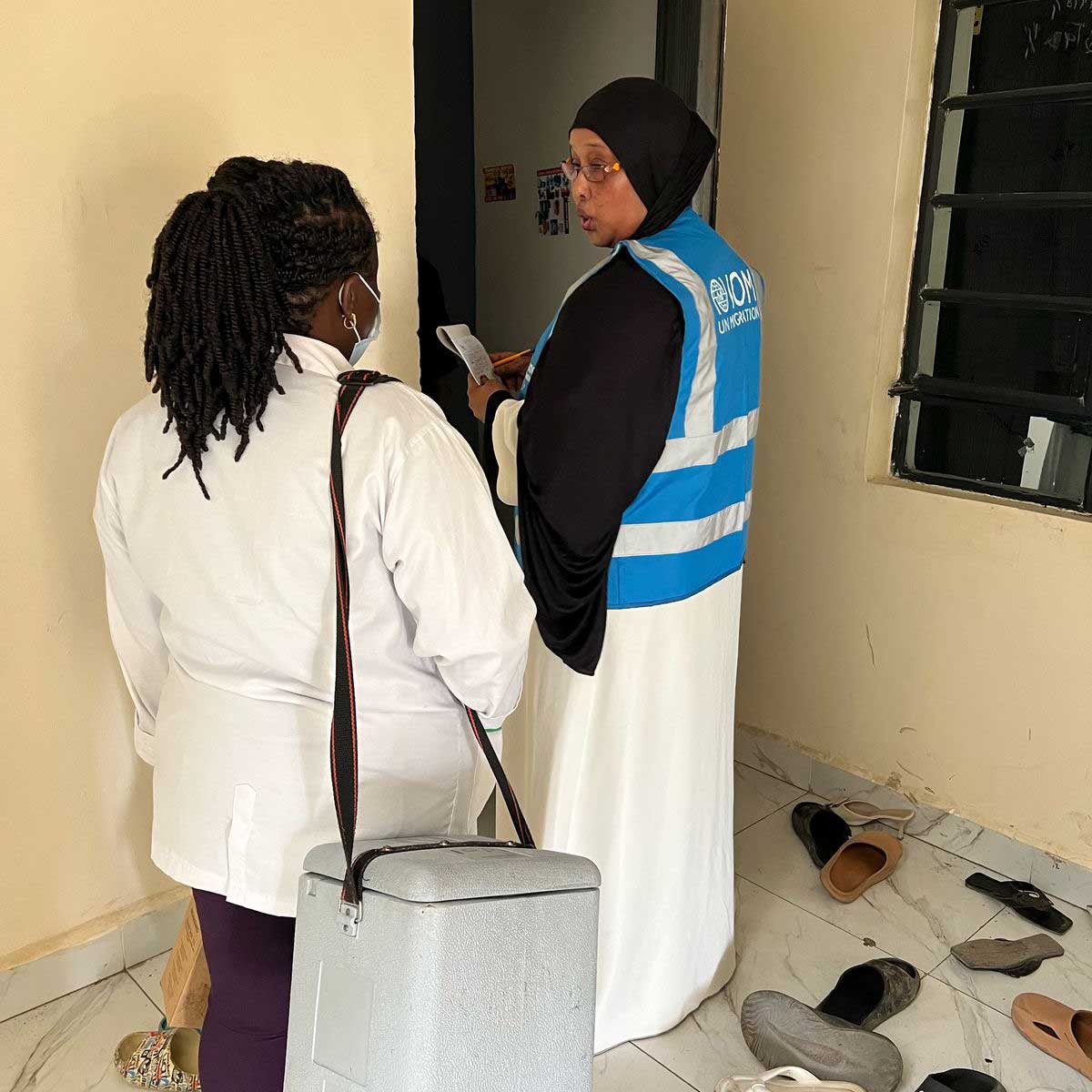 Fatuma Ahmed, a Community Health Promoter (CHP) in Eastleigh, accompanies a community health nurse during a door-to-door vaccine administration exercise. Credit: Fatuma Ahmed