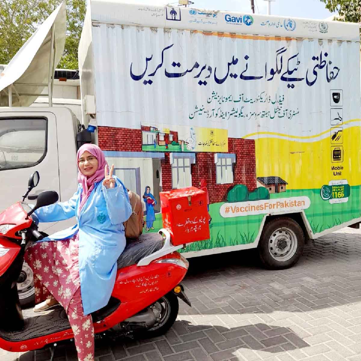 A female vaccinator in Karachi using Gavi-provided electric scooters to reach communities, particularly out-of-school girls, during the nationwide campaign to administer the HPV vaccine to 13 million adolescent girls across Pakistan. Credit: EPI Sindh