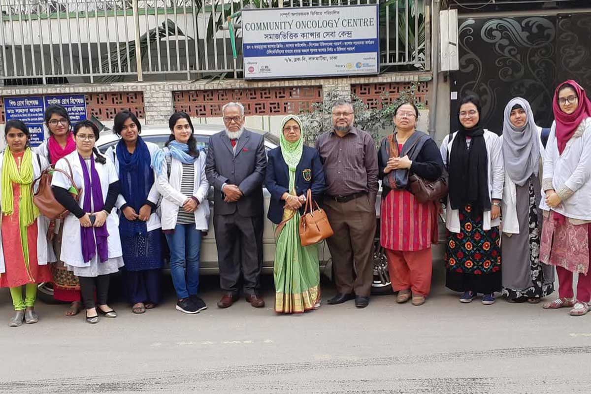 Habibullah Talukder Ruskin and his team in front of Community Oncology Centre (COC). Credit: COC